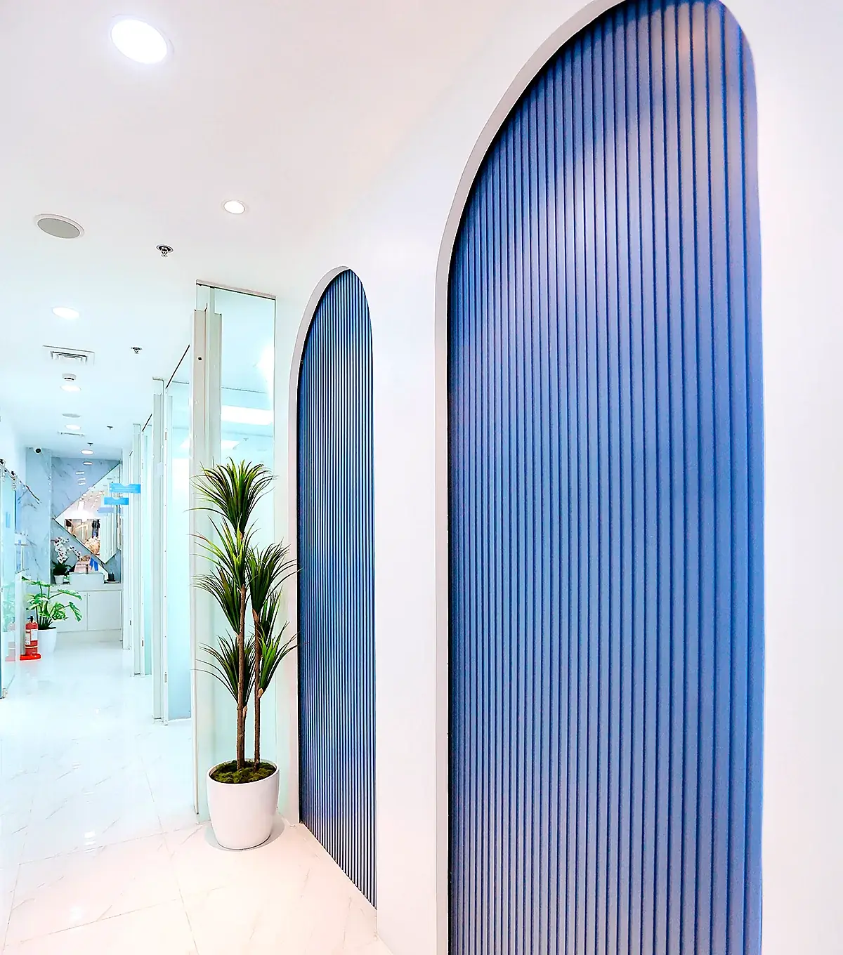 Bright hallway lined with blue arches