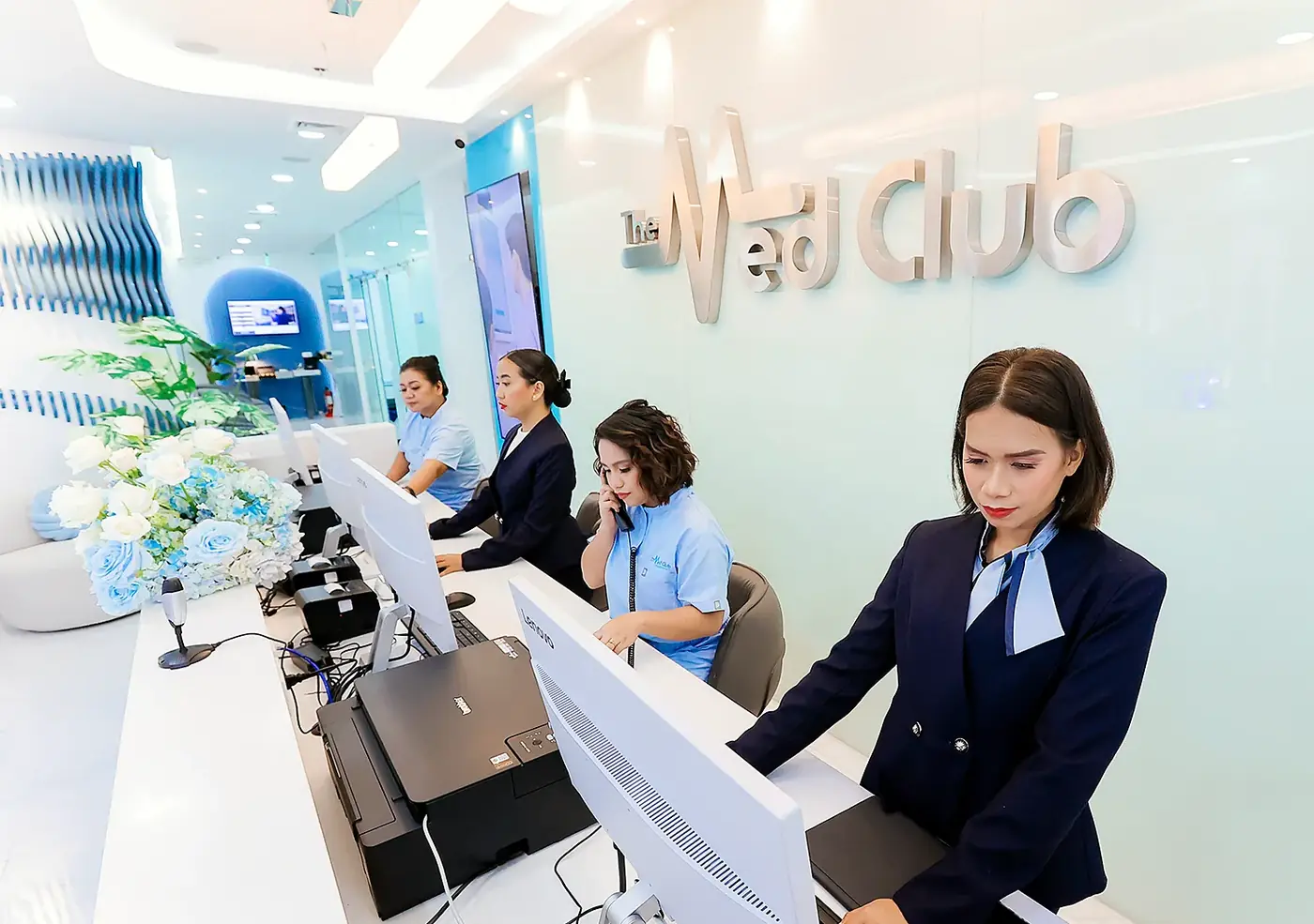 The Med Club concierge team at the front desk